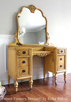 an antique vanity with a large mirror on the top and two drawers below, in front of a white wall