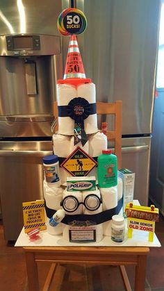 a cake made to look like a construction worker's hat and safety glasses on top