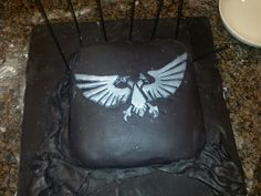 a square cake with an eagle on it