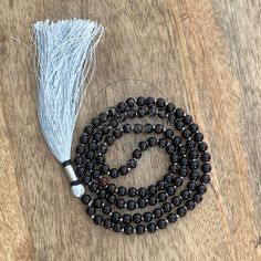 📿Karungali (black ebony wood) is a very powerful tree which our ancestors used. It was used in ancient temples and temple towers (kalasam); was also used in significant homams and other pooja rituals. Ebony Wood Mala is here to remind us to be current and clear-headed so we can make wise and informed decisions. We are being asked to seek new ways to create beauty and harmony that are sustainable for the long-term. This is a time to bring clarity to our intentions as we focus on the future.📿 ✨ Black Polished Beads Necklace For Meditation, Traditional Black Mala With 108 Beads, Holistic Black Round Beaded Jewelry, Holistic Black Round Beads Jewelry, Handmade Black Mala For Meditation, Black Gemstone Beads Mala For Healing, Handmade Black Mala As Gift, Black Amulet Style Necklaces With Polished Beads, Black Amulet Necklaces With Polished Beads