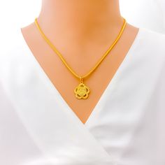 Immerse in the elegance of this Khanda pendant adorned with a delightful floral design. Crafted in 22k yellow gold, it weighs 1.7 grams and has a pendant length of 1". Its exquisite craftsmanship and brilliant finish make it a cherished accessory. Chain not included. PRODUCT DETAILS Gold Purity(karat): 22k Gold Weight(grams): 1.7 Item Finish: Yellow Gold Pendant Length: 1" Chain: Not Included Elegant Yellow Necklace For Puja, Gold Flower Pendant Necklace In 22k, Gold Necklace With 22k Gold Flower Pendant, 22k Gold Flower Pendant Necklace, Yellow 22k Gold Round Pendant Jewelry, 22k Gold Flower Pendant Necklace Gift, Yellow 22k Gold Pendant Necklace, 22k Yellow Gold Flower Pendant Necklace, Traditional Yellow Gold Flower Pendant Necklace