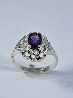 This stunning ring has been carefully crafted in 925 Sterling Silver and Authentic Amethyst . This ring would make a great birthday/special occasion gift. Buy it for your-self or for someone you love! This beautiful ring will not go unnoticed. All of my jewellery is handmade from scratch and of high quality. A tracking shipping number will be provided to you once ring has been mailed. Ring Measurements: Ring is size 7  but can be resized at no extra cost and will be shipped to you in an elegant Amethyst Rings, Rings Women, Birthday Special, February Birthstone, February Birth Stone, Beautiful Ring, Amethyst Ring, Elegant Gift, Rings Statement