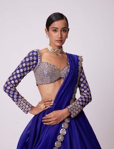 Step into sophistication with this persian blue organza hand-embroidered lehenga and dupatta ensemble. Adorned with intricate hand embroidery both the lehenga and dupatta exude elegance. Paired with a sleeveless blouse featuring real hand-cut mirror embroidery this ensemble captures timeless charm and grace perfect for weddings receptions or any special occasion where you want to shine. Blue Organza Lehenga, Full Sleeves Blouse, Vani Vats, Cape Lehenga, Kurta Lehenga, Lehenga Pattern, Full Sleeve Blouse, Organza Lehenga, Blue Organza