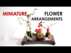 an arrangement of flowers and vases sitting on a table with the words miniature flower arrangements