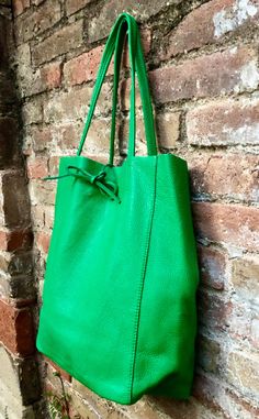 Large tote leather bag in GREEN. Leather shopper in Green closed with 2 leather straps at the top. Large enough for laptops, tablets, books etc. Natural GENUINE leather. The inside of the bag is not lined (although properly finished!). We added a small leather pouch on the inner part of the bag Excellent quality, soft but strong genuine leather. Width upper part: 41cm - 16 inch Height: 38 cm - 15 inch This listing is for the bag in GREEN ( first 4 pics). Also avalable in taupe, beige, black, bro Green Hobo Bag With Adjustable Strap For On-the-go, Green Large Capacity Crossbody Bucket Bag, Green Large Capacity Satchel Bucket Bag, Large Capacity Green Satchel Bucket Bag, Green Hobo Bag With Adjustable Strap And Double Handle, Green Crossbody Bucket Bag With Large Capacity, Green Square Bucket Bag With Large Capacity, Green Shoulder Bag With Adjustable Strap For Shopping, Modern Green Shoulder Bag With Large Capacity