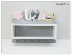 a white shelf with some magnets on it