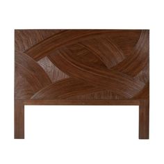 the headboard is made from wood and has an intricate design on it's sides