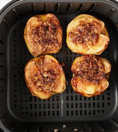 four pieces of food sitting in a air fryer