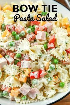 this bow tie pasta salad is loaded with peas, ham, and diced potatoes