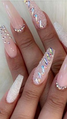 a woman's hand with some pink and white nails