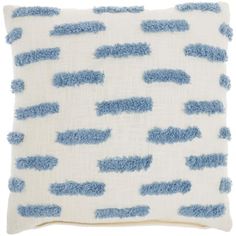 a blue and white pillow with small clouds on it's side, against a white background