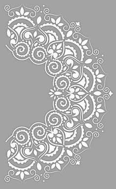 the letter c is made up of intricate white flowers and leaves on a gray background