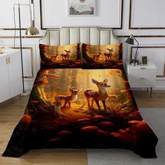 a bed with two deers in the woods on it's cover and pillow cases