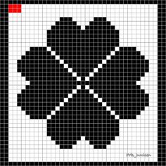 a black and white cross stitched pattern with red squares in the middle, on a square