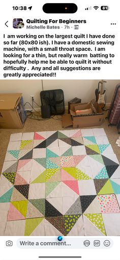 an image of a quilt on the floor with words written below it that read, i am working on the largest quilt i have done