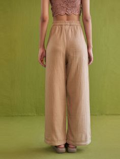 VALUES Handcrafted Organic Fair Minimal Waste CURATOR'S NOTE Fitted, wide-leg trousers crafted in azo-free dyed, double gauze organic cotton fabric. A classic pair of trousers are a perfect everyday go-to piece you can pair with shirts, crop tops, kurtas and more. THE DESIGNER STORY "Sui" is the new endeavor of the brand Sue Mue. A budding label, that aims to weave together our love for travel and connection with design. The brand believes in an optimistic and responsible fashion, that our world Shirts Crop Tops, Shirts Crop, Summer Trousers, Sweet Summer, Double Gauze, Organic Cotton Fabric, Brand Collection, Sustainable Fabrics, Wide Leg Trousers