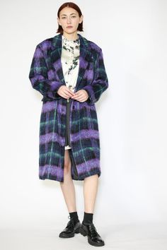 Step into elegance with our enchanting Wool Purple Plaid Coat. This purple-toned coat is carefully curated with a captivating interplay of dark and light shades, accented by a hint of refreshing mint green. This single-breasted coat exudes a distinctive charm, coupled with two side flap pockets and a classic lapel. Stay cozy and stylish throughout the year with our Heavy Wool Plaid, perfect for any season's cool and chilly weather. Composition: 100% Wool Heavyweight fabric Tailored for a relaxed Winter Formal Multicolor Outerwear, Formal Multicolor Winter Outerwear, Purple Long Coat For Formal Occasions, Formal Purple Long Coat, Wool Purple, Winter Event, American Fashion Designers, Single Breasted Coat, Dark And Light