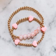 Hello Darling! Introducing our limited edition pastel mini pink heart 4mm 14k gold filled bracelets. Perfect to stack up and wear to your favorite name bracelet! Bracelets have 4mm gold 14k beadsWe hope you LOVE our new collection!(Pink name bracelet available in the shop.)