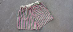 These are x-large drawstring cotton shorts.  The print on the shorts are stripes with pictures of flowers within the stripes.  The drawstring on the shorts is made of hemp.  This garment can be machine-washed and dry on low.   Shorts Measurements: Waist: 42" (drawstring) Hips: 46" Length: 16" Inseam: 3" If you have any questions or would like to see additional pictures, please do not hesitate to contact our shop. Thank you for your time. Green Cotton Pajama Shorts With Elastic Waistband, Green Relaxed Fit Cotton Pajama Shorts, Striped Cotton Beachwear Bottoms, Striped Cotton Pajama Shorts With Built-in Shorts, Green Cotton Pajama Shorts, Striped Cotton Shorts For Summer, Green Cotton Pajama Shorts For Vacation, Summer Cotton Shorts With Drawstring, Cotton Beach Shorts With Drawstring