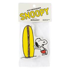 a snoopy sticker with an air freshener in the shape of a surfboard