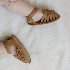 ***Looking for a larger size? Click HERE to see this same style with larger sizes in a hard sole.*** Introduce your little one to stylish comfort with our Camel Woven Sandals, available in US sizes 2-4. These adorable sandals are perfect for early walkers, combining a charming woven design with a soft sole for maximum comfort and flexibility. Crafted from genuine leather, they offer a delightful blend of style, quality, and ease of wear. Key Features: Adorable Design: The intricate woven pattern Comfortable Open Toe Sandals With Soft Sole, Brown Sandals With Soft Sole For Spring, Spring Slip-on Sandals With Soft Sole, Spring Flat Heel Sandals With Soft Sole, Comfortable Closed Toe Adjustable Sandals, Comfortable Closed Toe Sandals With Adjustable Fit, Comfortable Adjustable Closed Toe Sandals, Brown Non-slip Round Toe Sandals, Brown Closed Toe Sandals With Soft Sole