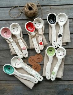 there are many spoons with faces on them