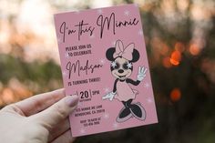 a person holding up a minnie mouse birthday card