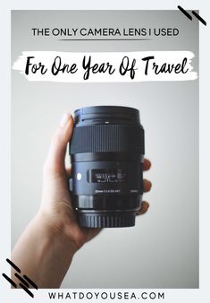 a person holding up a camera lens with the words, the only camera lens used for one year of travel