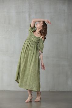 "This linen dress is full of contradictions, ensuring an eye-catching finish. The classic flared structure is contrasted by a slip design, whilst the ruffled details are given a contemporary twist with their asymmetric placement. In a moss green hue, this flared gown is here to turn heads at every event it attends. Off you go. 【Fabric】 95% linen, 5% silk it is Italian linen. exquisite high end texture. we add 5% silk to make it soft and exquisite. lightweight but a little sheer. looks gorgeous. Bohemian Green Linen Dress, Green Bohemian Linen Dress, Green Linen Bohemian Dress, Green Linen A-line Midi Dress, Green A-line Linen Midi Dress, Elegant Green Linen Summer Dress, Elegant Green Summer Linen Dress, Linen Kaftan, Linen Layers