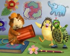 a group of animals standing next to each other on top of a green floor covered in toys