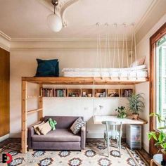 a living room filled with furniture and a loft bed next to a window on top of a rug