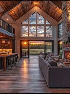 a large living room with wood floors and high ceilings