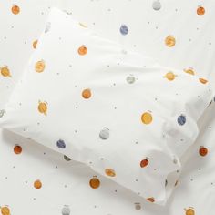 two pillow cases with planets printed on them