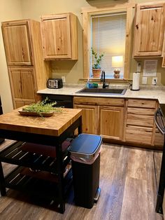 a kitchen with wooden cabinets and an island