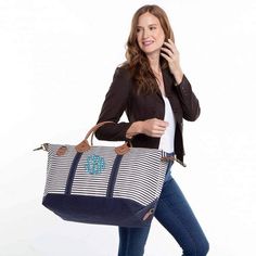 This striped weekender is a stylish statement piece that makes the best travel companion. With leather trim and antiqued brass hardware, this best-seller is good-looking and big enough for longer trips. Also works as a carry-on. This will be your favorite travel bag. Perfect for monogramming. This striped weekend tote comes beautifully embroidered with your monogram initials. 15" H X 28" W X 10" D 18 oz Canvas Top zip closure with leather accent pullers Genuine leather handles Internal pocket wi Cotton Travel Bag, Weekend Travel Bags, Striped Bags, Genuine Leather Totes, Bachelorette Weekend, Weekender Tote, Carry On Luggage, Weekend Getaway, Leather Handles