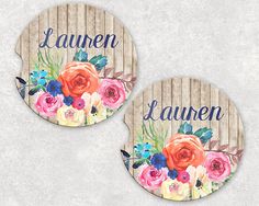 two coasters with flowers and the words lauren, lauren written in blue on them