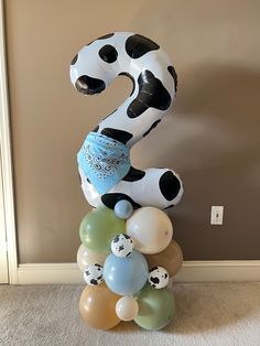 the number two is made out of balloons and has a dalmatian design on it