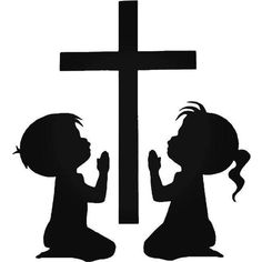 two children kneeling at the cross with their hands in front of them, one is praying