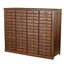 an old wooden cabinet with many drawers and brass knobs on the doors, isolated against a white background