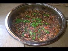 a pan filled with lots of food on top of a counter