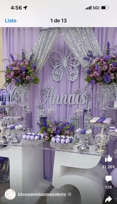 the table is decorated with purple and white decorations