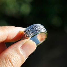 "This is a vintage style to our most liked spinner rings collection! It has the deep cameo Ashtamangala (\"Eight Auspicious\" in Tibetan Buddhism: parasol, pair of golden fish, conch, treasure vase, lotus, infinite knot, Dhvaja victory banner and Dharmachakra golden wheel ) embossed on the outside, with a most favorited spinning action. Tibetan Buddhists make use of the particular set of eight auspicious symbols -- ashtamangala, in household and public art. It's consider one of the most importan Eight Auspicious Symbols, Golden Fish, Man Ring, Chinese Man, Rings Collection, Ring Mens, Meditation Rings, Silver Spinner Rings, Conch Shell