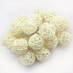 several balls of white yarn on a white background