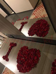 two mirrors with red flowers on them in the shape of a heart and an i love you sign