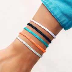 Our new Mini Braided Solid bracelets are a delicate take on a classic style. Every bracelet is 100% waterproof. Go surf, snowboard, or even take a shower with them on. Wearing your bracelets every day only enhances the natural look and feel. Every bracelet is unique and hand-made therefore a slight variation in color combination may occur. 100% waterproof Wax-coated Adjustable from 2-5 inches in diameter Pura Vida supports artisans worldwide Bff Bracelet, Bracelet Colors, Cute Friendship Bracelets, Bff Bracelets, Surfer Bracelets, Pura Vida Bracelets, Bracelets Design, Diy Bracelet Designs, Friendship Bracelets Diy