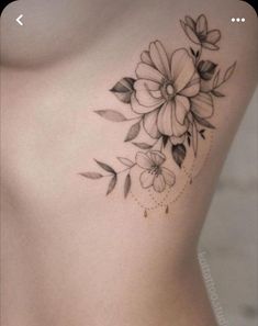 a woman's chest with flowers on it