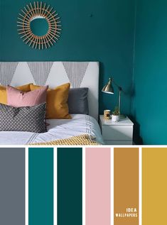 a bedroom with teal walls and gold accents