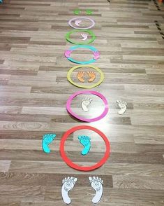 there are many different colored circles on the floor with footprints in them and one is painted