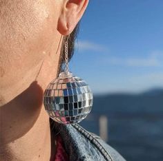 Description: Our unique Disco Ball Earrings are the perfect addition to any aesthetic outfit! A must have jewelry piece for any 70's or retro aesthetic style lover! Style: Aesthetic Earrings, Aesthetic Jewelry Size: 5 cm x 3 cm/ 1.96 in x 1.18 in Free shipping Worldwide Delivery time: 15-35 days Retro Dangle Earrings For Festivals, Retro Metal Earrings For Party, Retro Jewelry For Pierced Ears For Parties, Retro Metal Party Earrings, Retro Pierced Jewelry For Party, Bola Disco, Disco Ball Earrings, Lover Style, Must Have Jewelry