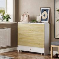 a living room with a radiator, chair and pictures on the wall next to it